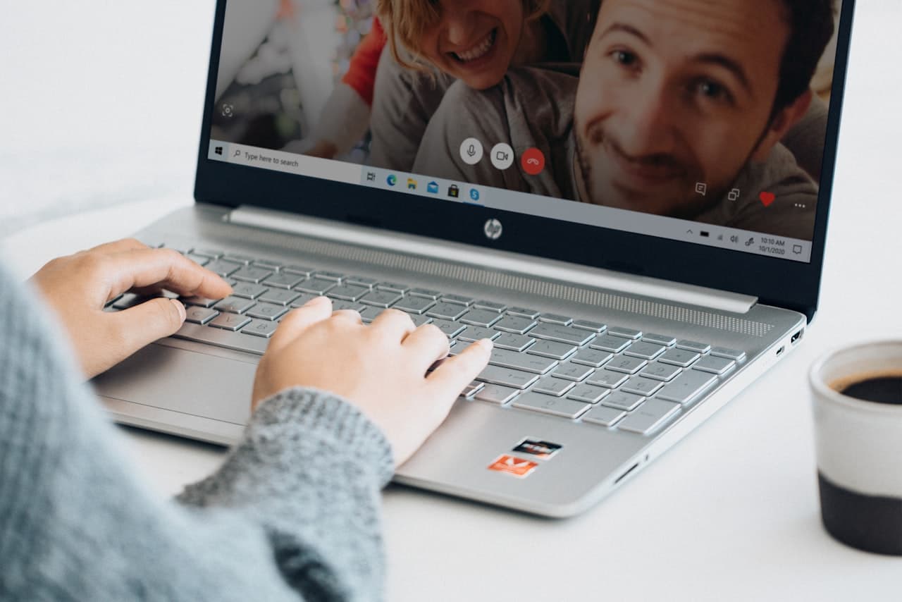 A person speaking with a practitioner over a video call at home